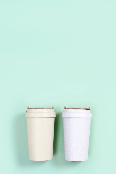 Reusable eco friendly bamboo cup for take away coffee. Eco friendly zero waste solution for low impact sustainable lifestyle. - Fotoğraf, Görsel