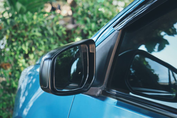 Close up of car side mirror in the garden - Fotó, kép