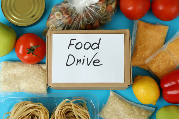 Concept of food drive with meal on blue background - Photo, Image