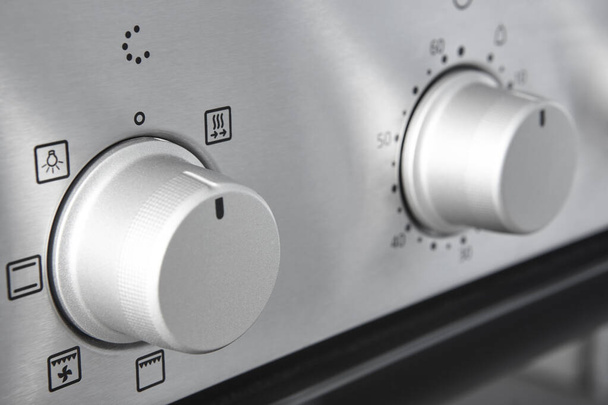 Botão de controle de temperatura de cozimento do forno. Detalhes do painel de equipamentos de cozinha. Fogão - Foto, Imagem