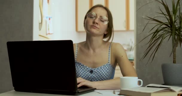 Young mother tries to work while children are making noise and running around house. Freelancer woman tired of working at home - Footage, Video
