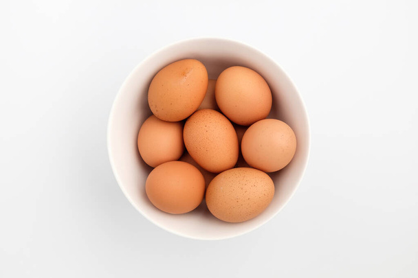 Chicken eggs. Fresh ingredients. Egg in a round shape - Foto, afbeelding