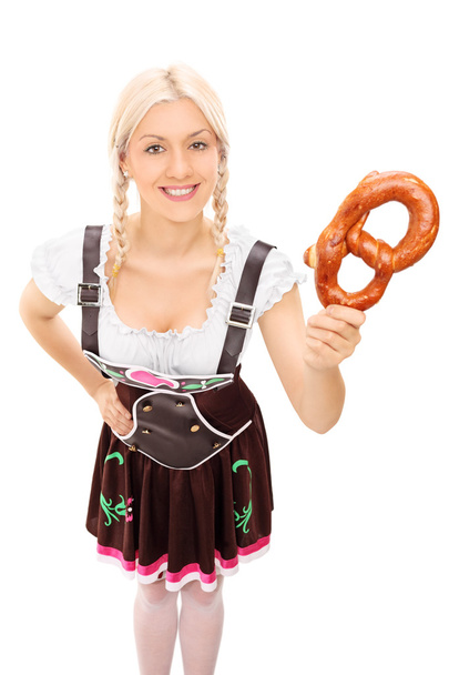 Woman holding pretzel - 写真・画像