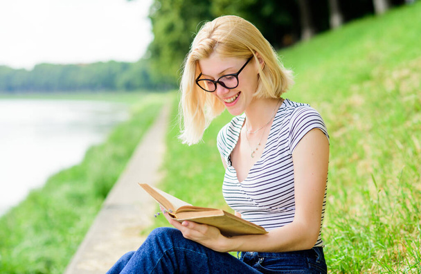 learn reading books. student girl with book outdoor. reading is my hobby. Summer study. interesting story. Relax and get new information. inspired by novel author. woman in park reading book - Foto, Imagem