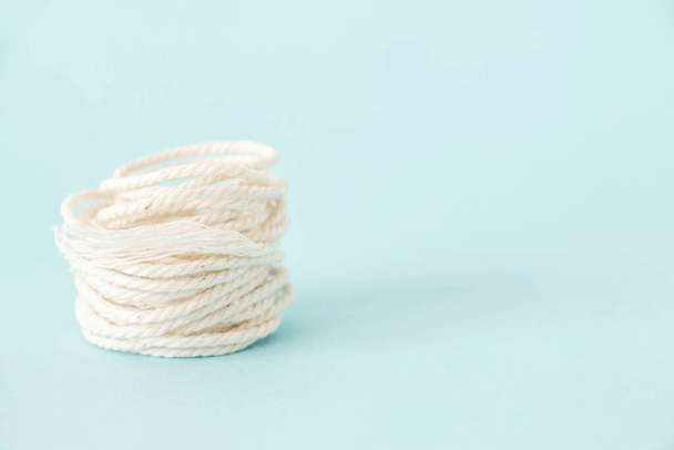 knitting yarn on blue background - 写真・画像