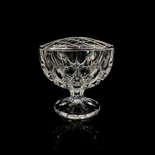 antique crystal rose bowl on black background - Foto, afbeelding