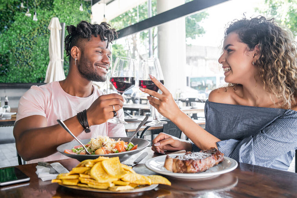 Couple having a date at a restaurant. - Фото, изображение