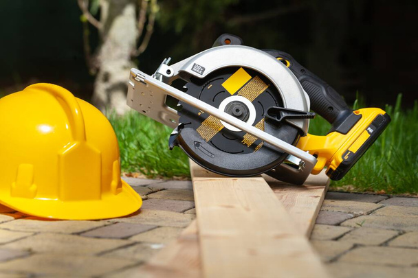 Construction carpentry tools electric corded circular saw cordless drill on background - 写真・画像
