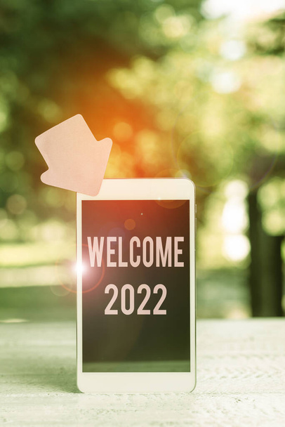 Writing displaying text Welcome 2022. Internet Concept New Year Celebration Motivation to Start Cheers Congratulations Abstract Outdoor Smartphone Photography, Displaying New Device - Photo, Image