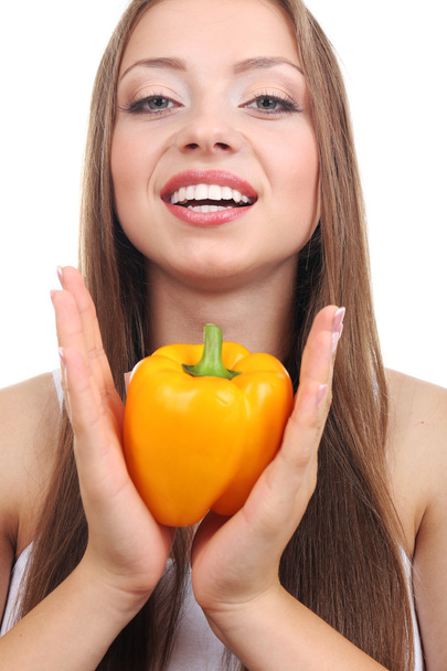 Beautiful girl with yellow pepper - Foto, afbeelding