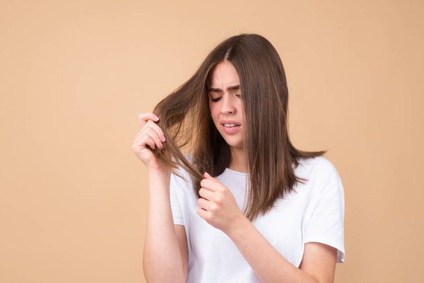 Woman worried about hair loss. Hair fall problem. - 写真・画像