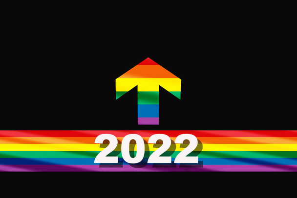 Новий 2022 рік на барвистому веселковому прапорі, що починається з лінії і стрілки на чорному тлі. Концепція свободи різноманіття та соціальна ідея рівності
 - Фото, зображення