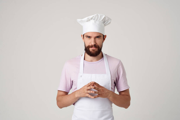 hombre en chefs ropa cocina cocina profesión luz fondo - Foto, Imagen