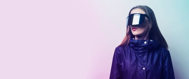 Young woman with glasses and BP in a blue jacket added gradient on a light background. Banner. - Photo, Image