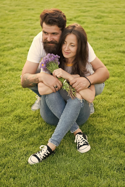 Flowers on Valentines day. Couple in love celebrate valentines day. Hipster hug sexy girl green grass. Valentines day celebration. Floral shop. Happy Valentines Day - Фото, зображення
