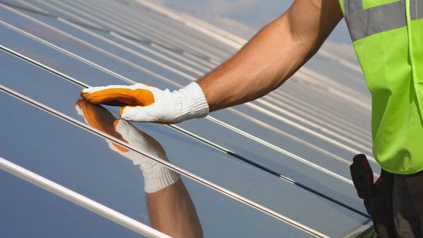 Crop engineer touching solar panel - Photo, Image