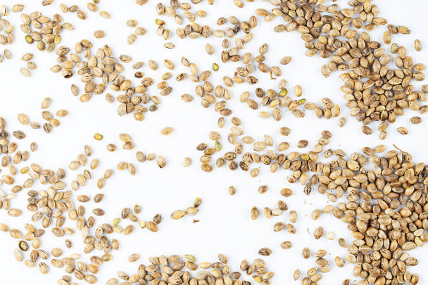 Heap of hemp seeds on a white background. - Photo, Image