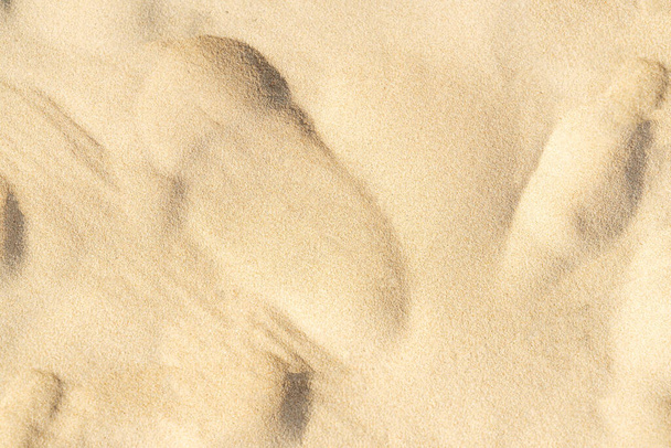 Texture sable sur la plage. Plage de sable brun pour le fond. Gros plan. - Photo, image