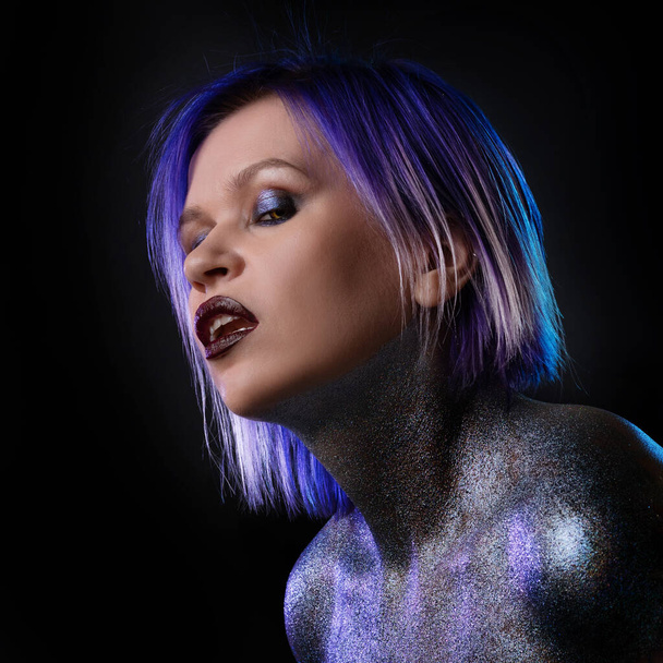 Portrait of a stylish and daring young woman with purple hair - Φωτογραφία, εικόνα