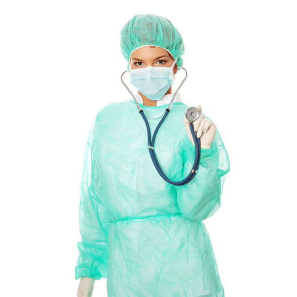 Female surgeon with sthetoscope, isolated on white - Foto, imagen