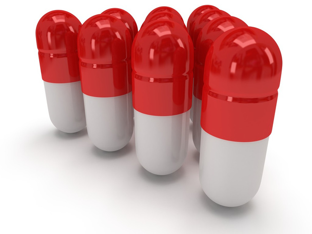 3d medical pills stand like pyramid on white - Fotoğraf, Görsel