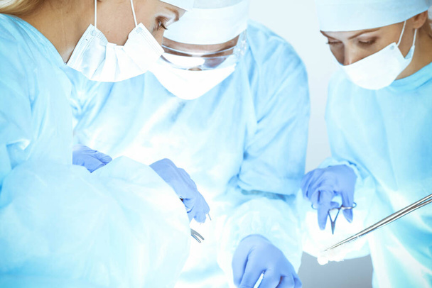 A group of surgeons is operating at the hospital. Health care concept - Foto, imagen