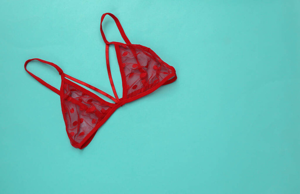 Red sexy bra on a blue background - Photo, Image