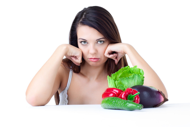 Chica joven con verduras sobre fondo blanco
 - Foto, Imagen