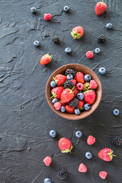 A healthy serving of fresh summer berries. Creative atmospheric decoration - Foto, imagen
