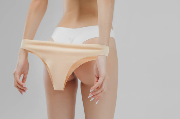 Aesthetic womans body in underwear on white background - 写真・画像