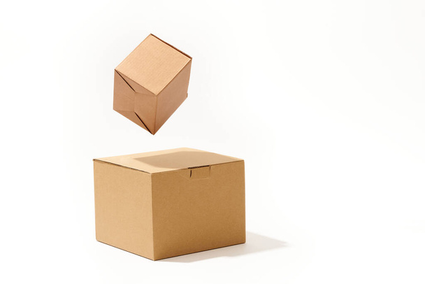 Close-up shot of different shaped cardboard boxes isolated on white background - Foto, immagini