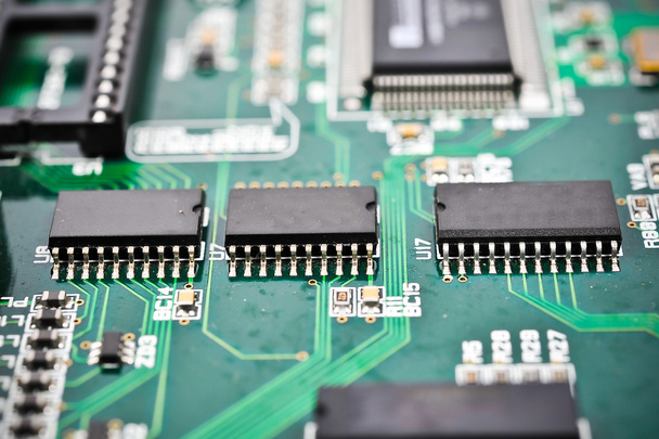 placa de circuito com componentes eletrônicos macro fundo
  - Foto, Imagem