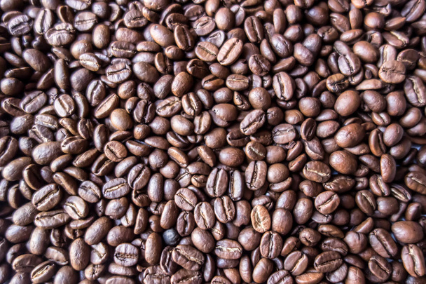 Ruskeat paahdetut kahvipavut tausta. Kahvipapujen rakenne - Valokuva, kuva