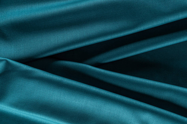 bright turquoise draped fabric, background, texture - Foto, Imagen