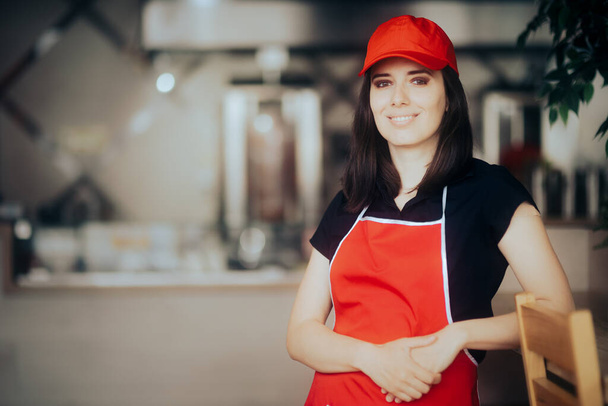 Happy Smiling Fast-Food Worker Standing in a Restaurant - Φωτογραφία, εικόνα