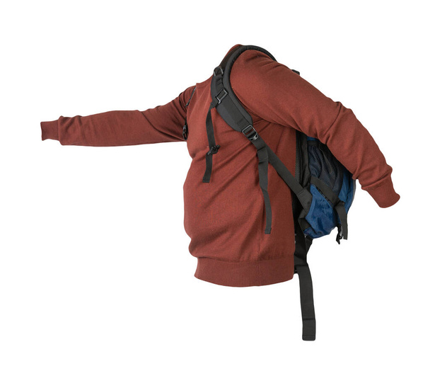 blue  backpack dressed in a knitted red sweater isolated on a white background. backpack and male sweater view from the back - Foto, afbeelding