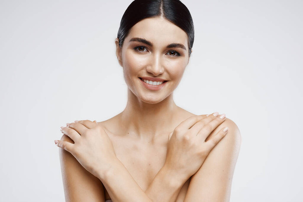 pretty woman with bare shoulders and clean skin close-up cosmetics - Фото, зображення
