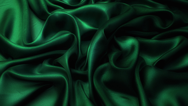 Zijde satijnen stof. Groene kleur. Textuur, achtergrond, patroon. - Foto, afbeelding