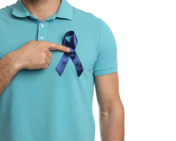 Man with blue ribbon on white background, closeup. Urology cancer awareness - Fotoğraf, Görsel