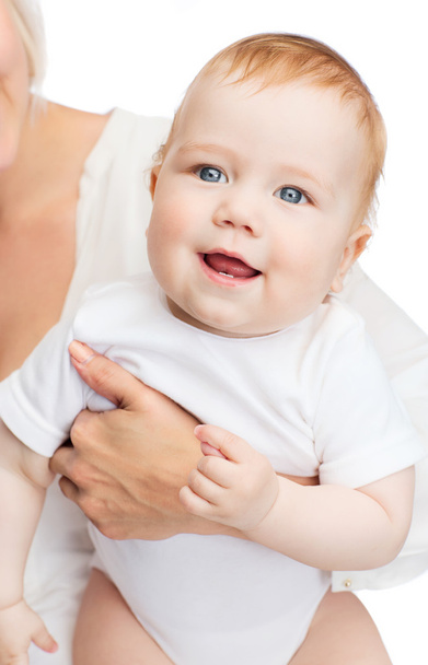 close up of mother holding smiling baby - Foto, Imagem