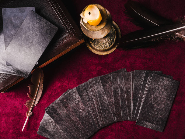 Divination cards, candles and dark background. View from above. Close-up - Fotoğraf, Görsel