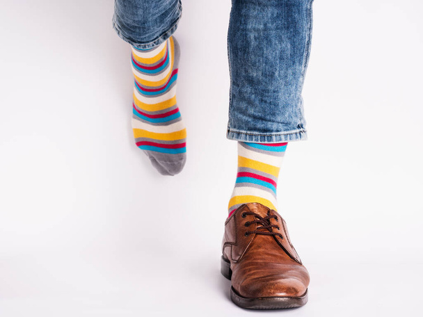 Men's legs, trendy shoes and bright socks. Close-up. Style, beauty and elegance concept - Fotó, kép