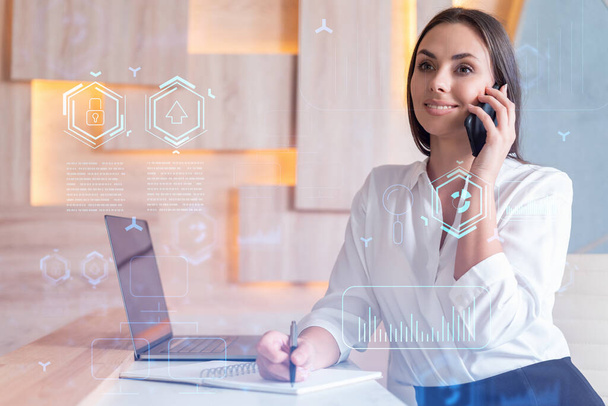 Attractive businesswoman in white shirt has conference call to optimize development by implying new technologies in business process. Hi tech hologram over office background - Foto, imagen