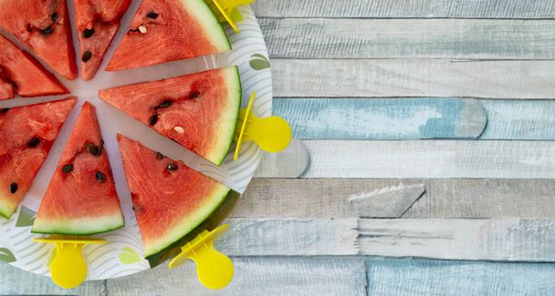 Flat lay of watermelon triangular slices on sticks. Fresh fruit popsicles summer refreshing cooling - Photo, Image