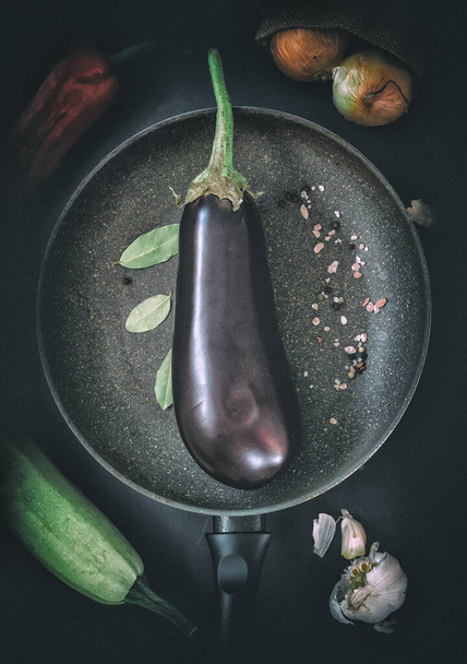 Eggplant in frying pan diet concept with vegetables vegan meal - Photo, Image