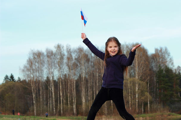 Patriotic little girl holding Russian flag - Fotografie, Obrázek