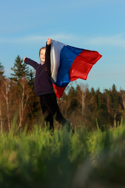 Beautiful little girl with Russian flag - Zdjęcie, obraz