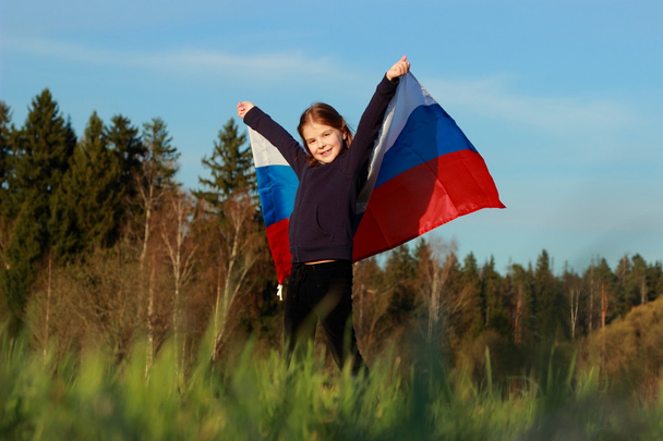 Beautiful little girl with Russian flag - Valokuva, kuva