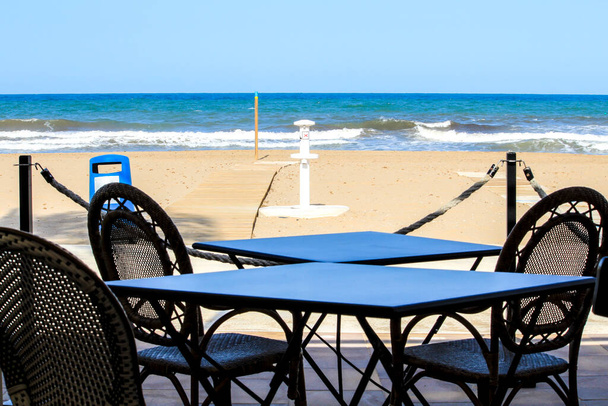 Bar with empty terrace on Santa Pola beach on a sunny day - Photo, Image