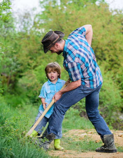 Adventure hunting for treasures. Little helper working in garden. Cute child in nature having fun with shovel. Find treasures. Little boy and father with shovel looking for treasures. Happy childhood - Foto, Bild